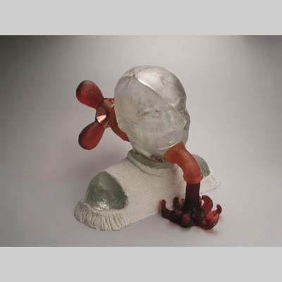 Portraits & People - Brain Drain - Turning a faucet on the back of one's head to let the blood (or creative juices) spill out. Allegory for the act of creation.  Hot cast glass, kiln-cast lead crystal & concrete