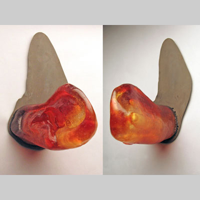 Hands & Hanging - Hear - An ear with a hand inside. (Two views of the same piece.) Kiln-cast lead crystal & steel