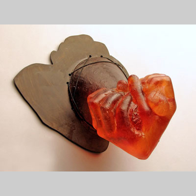 Hands & Hanging - Heart in My Hand - Two fists shaped like, and perhaps holding, a heart. Kiln-cast lead crystal & steel