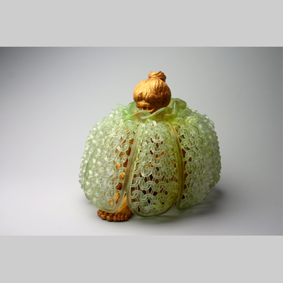 Portraits & People - Cozy - A seated woman with her knees pulled into her chest, covered by a knitted glass cage like a "tea cozy".  Is it to protect her?  or keep her contained?  Being made of glass, its protective ability is illusory. Kiln-Cast lead crystal knitted glass & raku