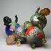 Bombs <br>& <br>Babies - It's a Small World - Globes with baby heads, hands and feet.  They all have names of internet companies which have made the world a smaller place. Kiln-Cast lead crystal knitted glass & raku