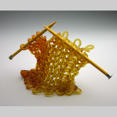 Knitting & Knitted - Bent - I've been criticized for using old plastic needles with my knitted glass.  But I like the juxtaposition.  It's not the quality of the tool that creates beautiful work, but rather the skill of the worker.   Kiln-Cast lead crystal knitted glass & needles