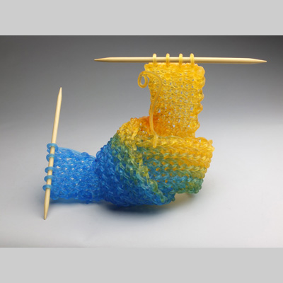 Knitting & Knitted - Knit Knot - A piece of knitting tied in a knot Kiln-Cast lead crystal knitted glass & needles